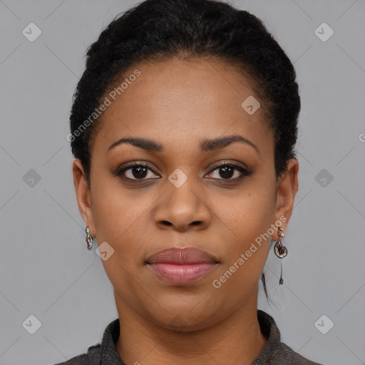 Joyful black young-adult female with short  black hair and brown eyes