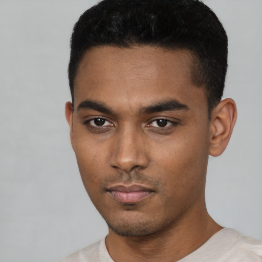 Neutral black young-adult male with short  black hair and brown eyes