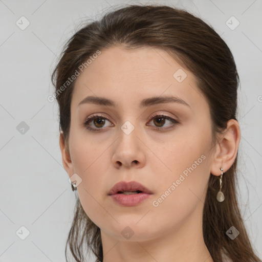 Neutral white young-adult female with long  brown hair and brown eyes