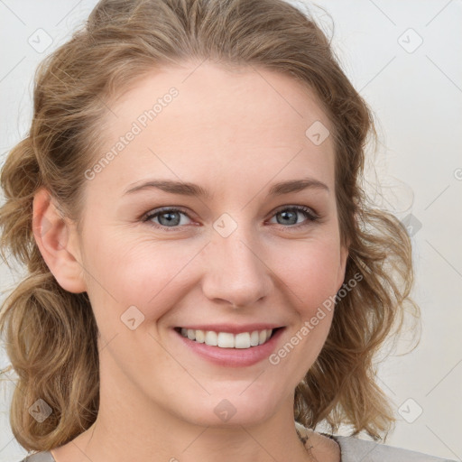 Joyful white young-adult female with medium  brown hair and blue eyes