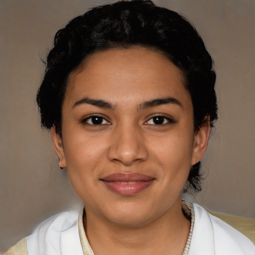 Joyful latino young-adult female with short  brown hair and brown eyes