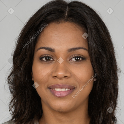 Joyful black young-adult female with long  brown hair and brown eyes