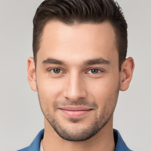 Joyful white young-adult male with short  brown hair and brown eyes