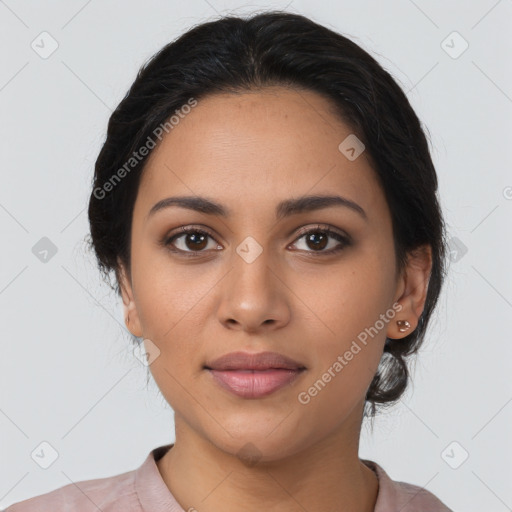 Joyful latino young-adult female with medium  brown hair and brown eyes