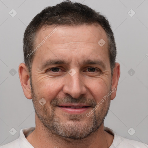 Joyful white adult male with short  brown hair and brown eyes