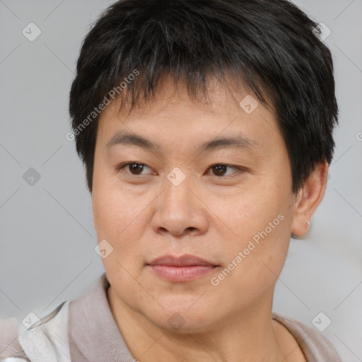 Joyful asian young-adult male with short  brown hair and brown eyes