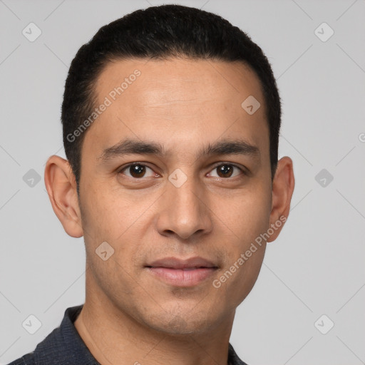 Joyful white young-adult male with short  black hair and brown eyes