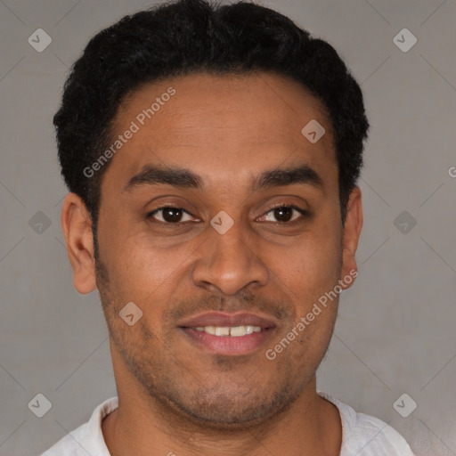 Joyful latino young-adult male with short  black hair and brown eyes