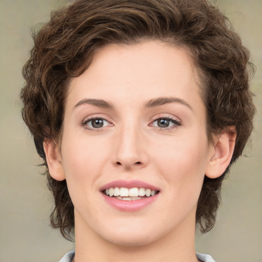 Joyful white young-adult female with medium  brown hair and green eyes