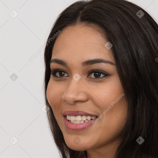 Joyful latino young-adult female with long  black hair and brown eyes