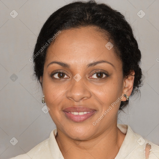 Joyful black adult female with medium  brown hair and brown eyes