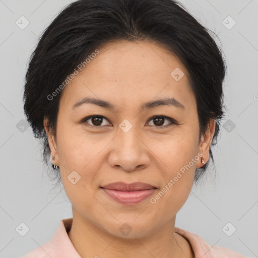 Joyful asian adult female with medium  brown hair and brown eyes