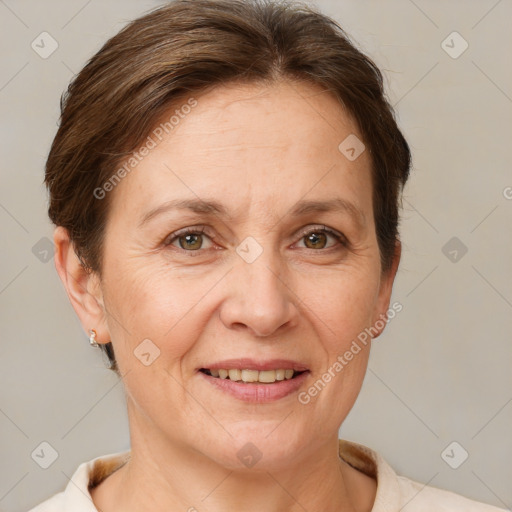 Joyful white adult female with short  brown hair and brown eyes