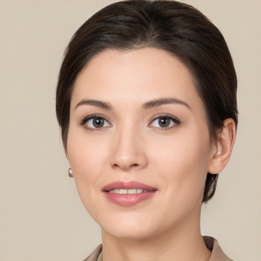 Joyful white young-adult female with medium  brown hair and brown eyes