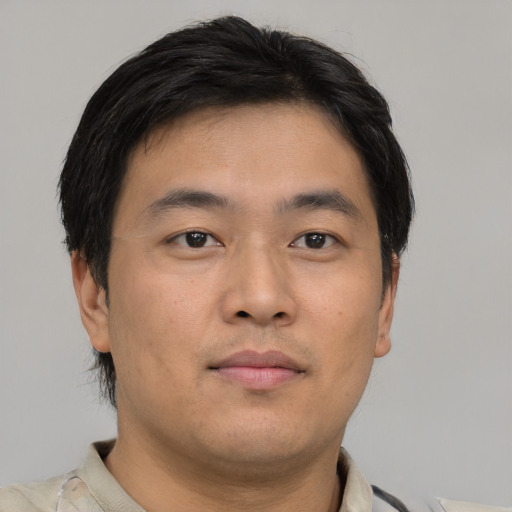 Neutral asian young-adult male with short  brown hair and brown eyes