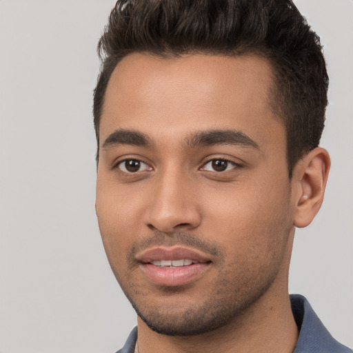 Joyful white young-adult male with short  black hair and brown eyes