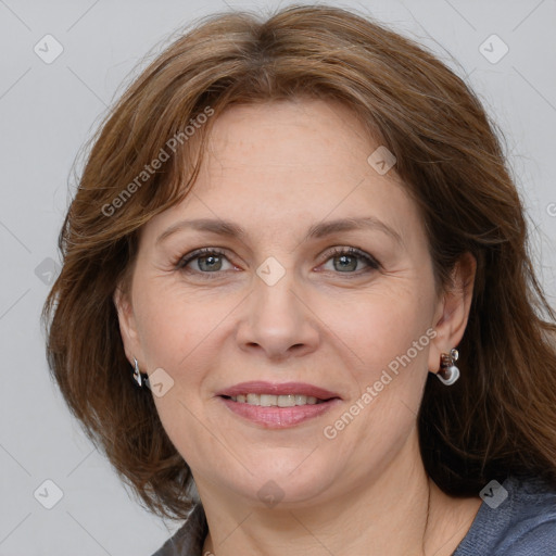 Joyful white adult female with medium  brown hair and grey eyes