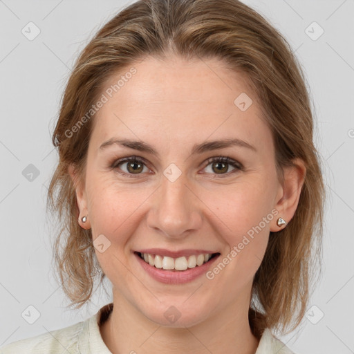 Joyful white young-adult female with medium  brown hair and grey eyes