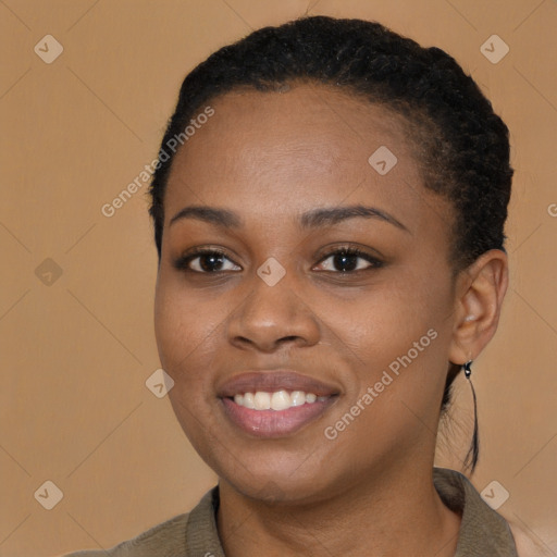 Joyful black young-adult female with short  brown hair and brown eyes