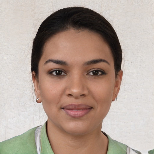 Joyful latino young-adult female with short  brown hair and brown eyes