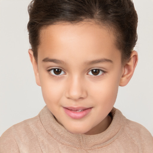 Joyful white child female with short  brown hair and brown eyes