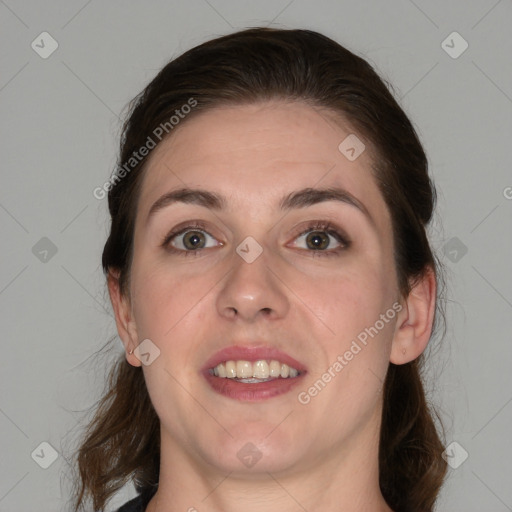 Joyful white young-adult female with medium  brown hair and grey eyes