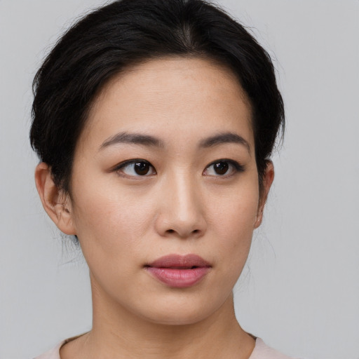 Neutral white young-adult female with medium  black hair and brown eyes