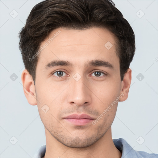 Neutral white young-adult male with short  brown hair and brown eyes