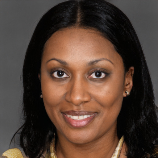 Joyful black young-adult female with medium  brown hair and brown eyes