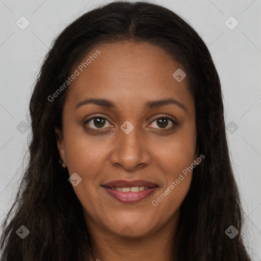 Joyful black young-adult female with long  brown hair and brown eyes