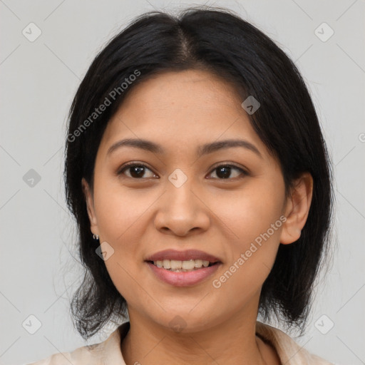 Joyful latino young-adult female with medium  black hair and brown eyes