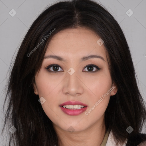 Joyful asian young-adult female with long  brown hair and brown eyes