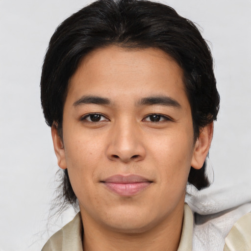 Joyful asian young-adult male with short  brown hair and brown eyes