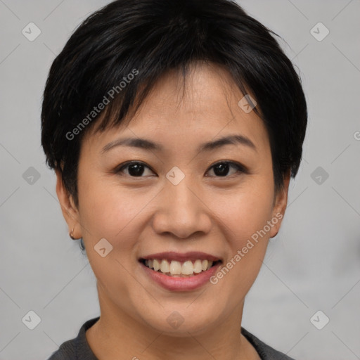 Joyful asian young-adult female with short  brown hair and brown eyes