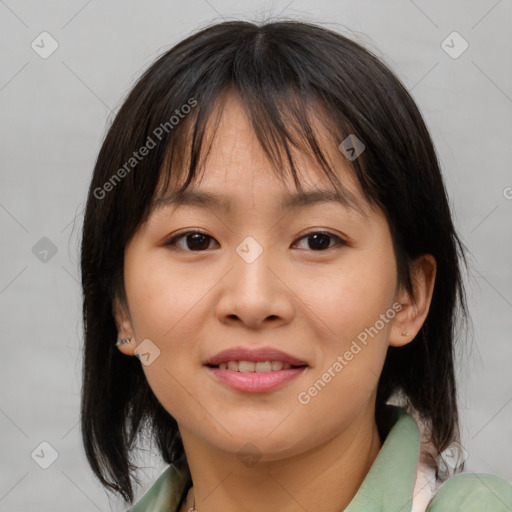 Joyful asian young-adult female with medium  brown hair and brown eyes