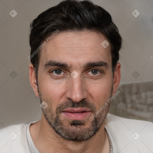 Joyful white adult male with short  brown hair and brown eyes