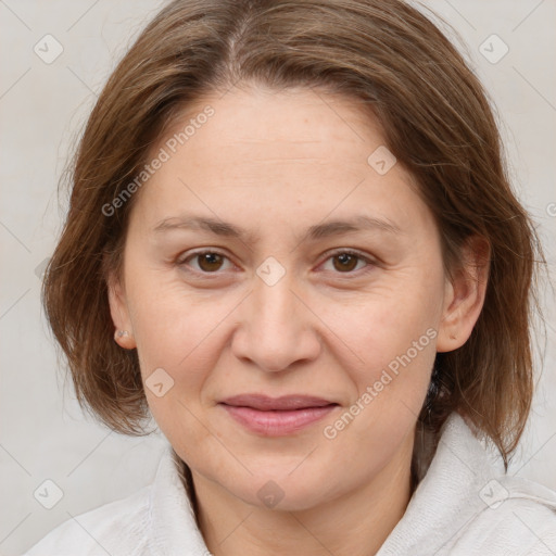 Joyful white adult female with medium  brown hair and brown eyes