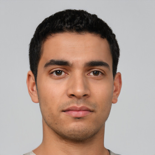 Neutral latino young-adult male with short  black hair and brown eyes