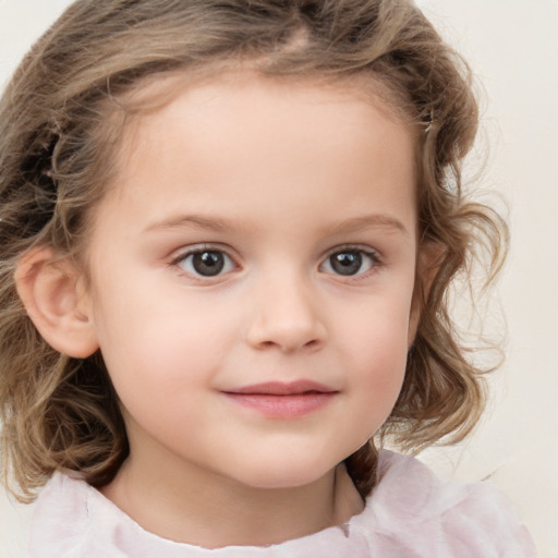 Joyful white child female with medium  brown hair and grey eyes