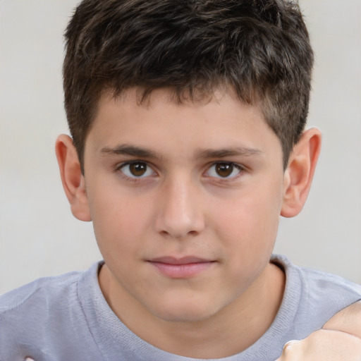 Joyful white child male with short  brown hair and brown eyes