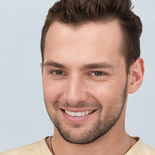 Joyful white young-adult male with short  brown hair and brown eyes