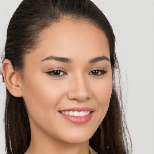 Joyful white young-adult female with long  brown hair and brown eyes