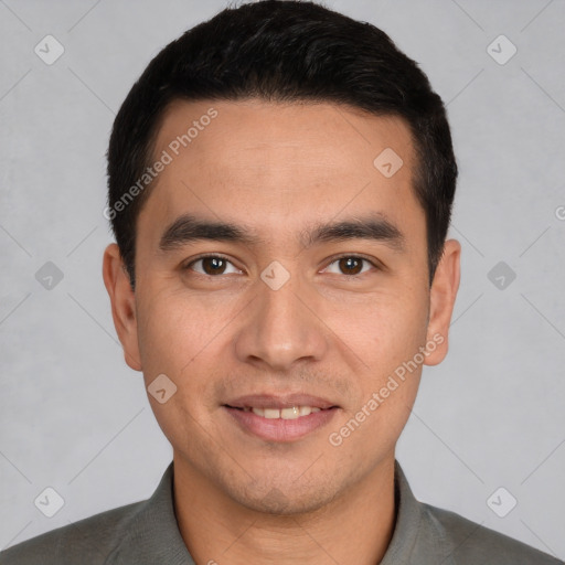 Joyful white young-adult male with short  black hair and brown eyes