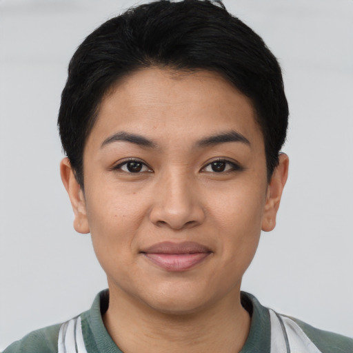 Joyful asian young-adult female with short  brown hair and brown eyes