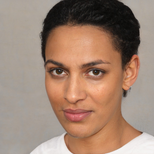 Joyful white young-adult female with short  brown hair and brown eyes