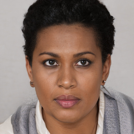 Neutral black young-adult female with short  brown hair and brown eyes