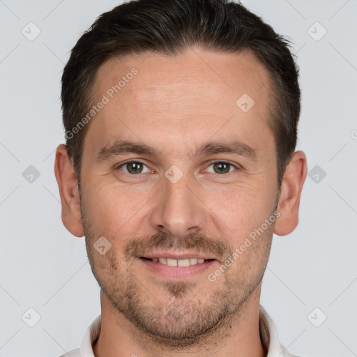 Joyful white young-adult male with short  brown hair and grey eyes