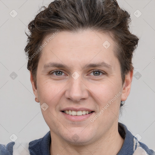 Joyful white adult female with short  brown hair and grey eyes