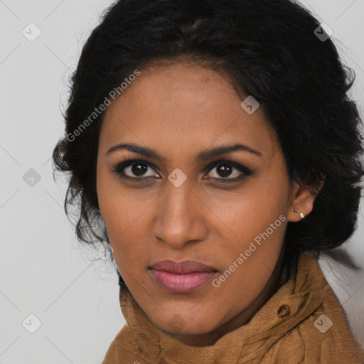 Joyful black young-adult female with long  brown hair and brown eyes