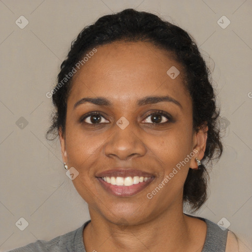 Joyful black young-adult female with medium  black hair and brown eyes